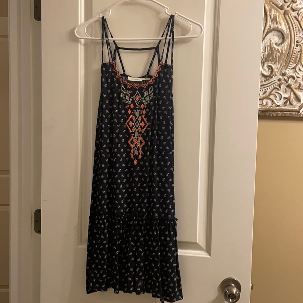 Navy blue sun dress with spaghetti straps.